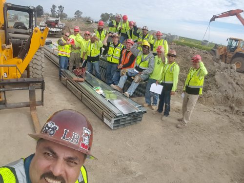 An image of the construction team at a site posing together