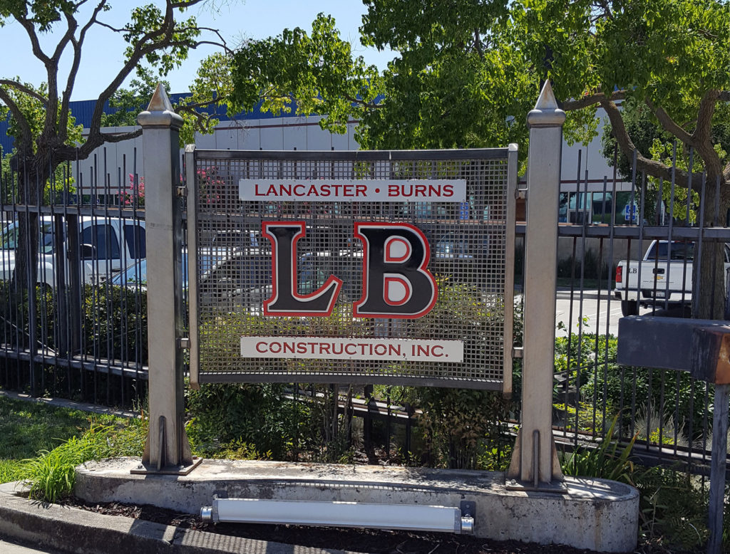 An image of a sign with LB Construction logo on it